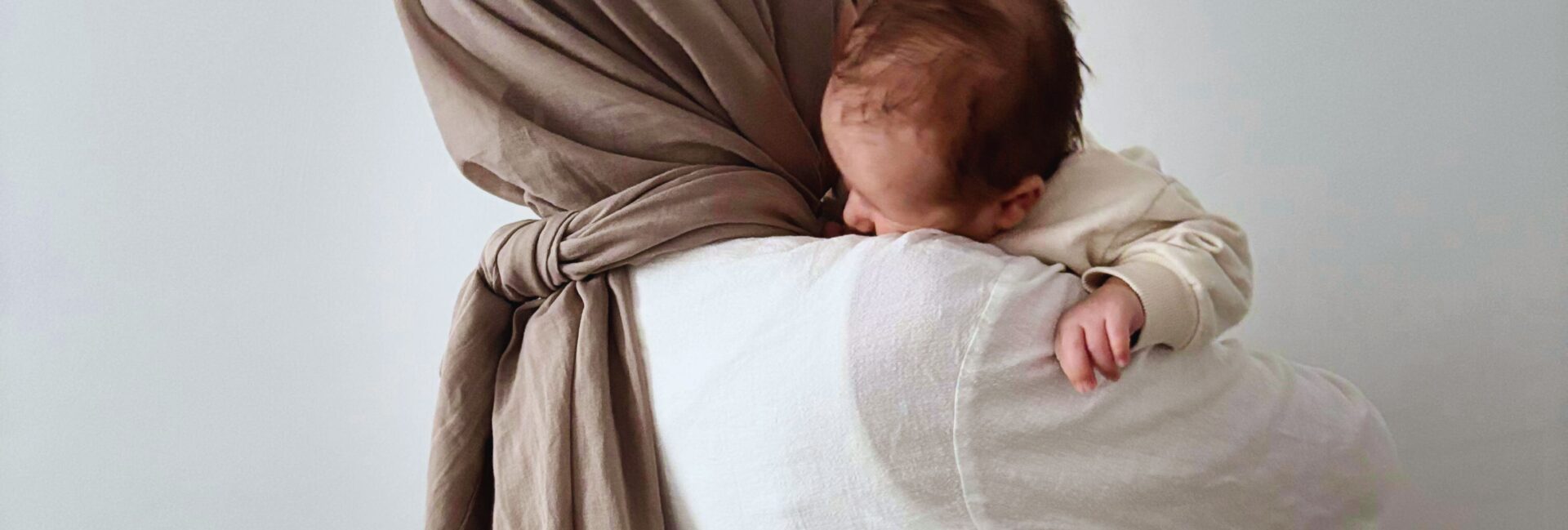 Hijabi woman carrying baby, mother mary carrying Jesus, Mary is our mother, veiled woman holding her baby,